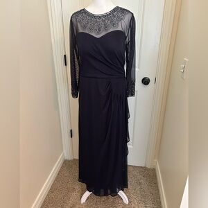 Navy knit, very flattering, gown. Has illusion neckline and sleeve bead design.